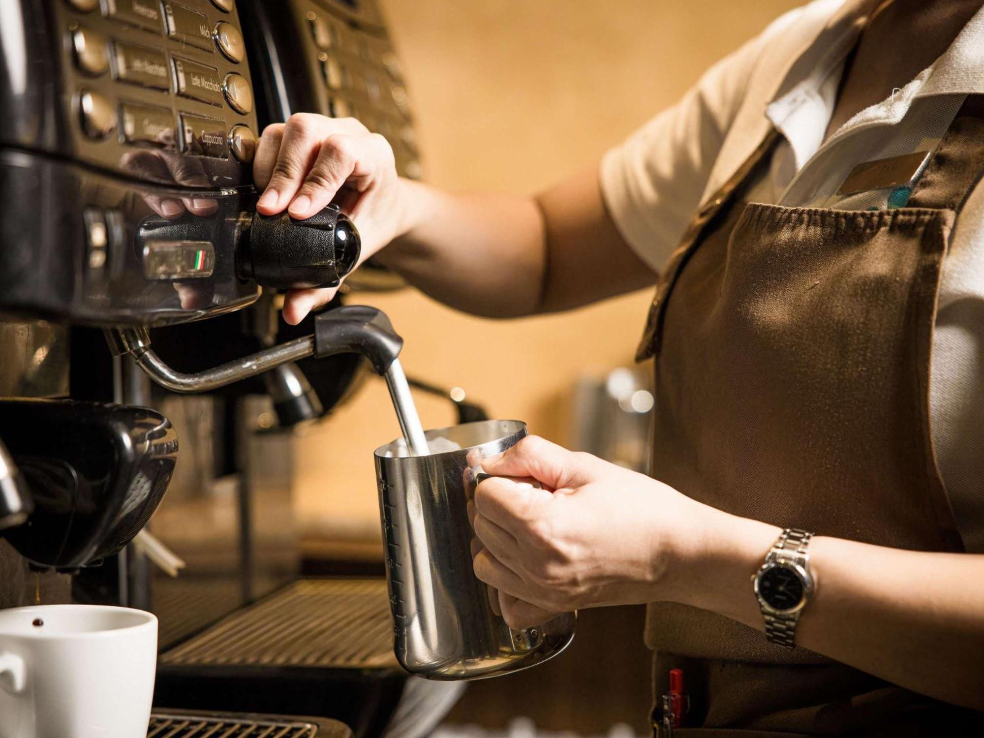 Grand Mercure Phuket Patong Екстериор снимка A barista making espresso