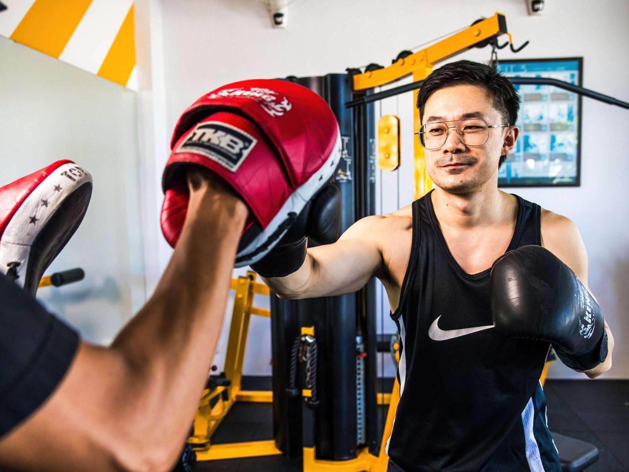Grand Mercure Phuket Patong Екстериор снимка A boxer training with a heavy bag